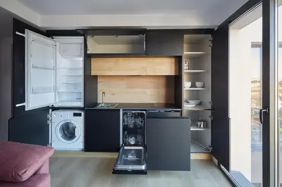 a kitchen with a washer and dryer in a room at HAVANAAPARTAMENTOS in Puerto de Vega