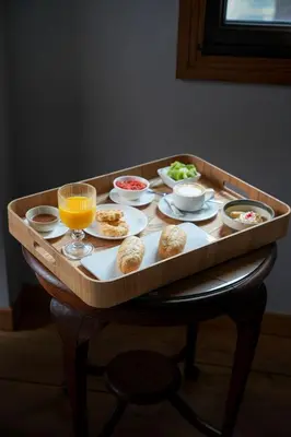 a tray with food and drinks on a table at Hotel Rústico Fonteverde in Cuntis