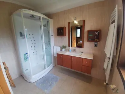 a bathroom with a shower and a sink at Casa Aida in Foz
