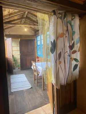 a view of a room with a table and a window at Sons do Eo- Apartamentos ecológicos en la montaña de Lugo in Baleira
