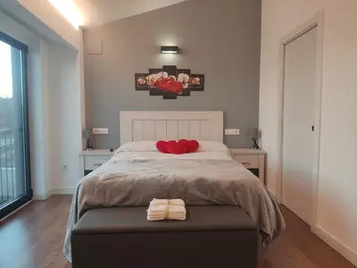 a bedroom with a bed with two towels on it at Armada Sacra A Teixeira in Ourense