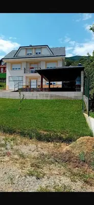 a large house with a pavilion in front of a yard at Casa turismo rural Becar in Corullón