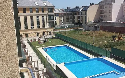 a large swimming pool on top of a building at FOZ II PLAYAS in Foz