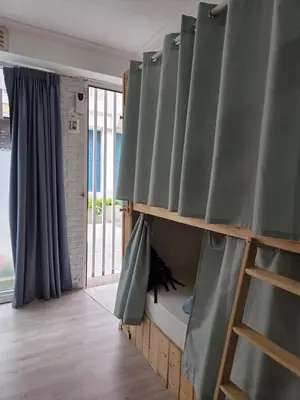 a room with a bunk bed and a window at Hostel Bretema in Lugo