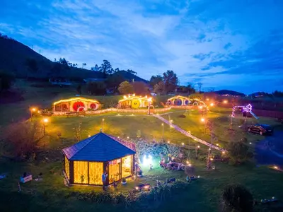 a group of tents in a field at night at Mi Tesoro in Viveiro