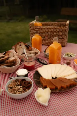 a picnic table with bread and other food and drinks at Mi Tesoro in Viveiro