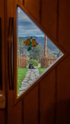 a window of a train looking out at a pathway at Mi Tesoro in Viveiro