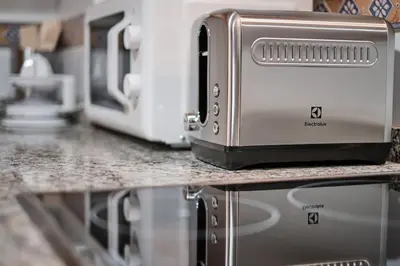 a toaster oven sitting on a counter in a kitchen at Yuhom, casas con alma. Xacedos 3 in Miño
