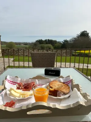 a tray of food and a drink on a table at Caraxolas in Lugo