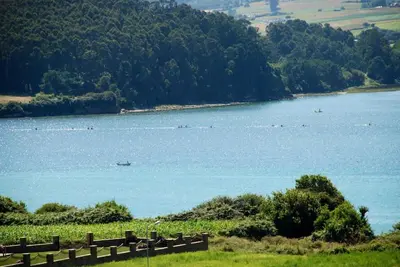 a large body of water with boats in it at Ático con vistas a la ría y a Foz in Barreiros