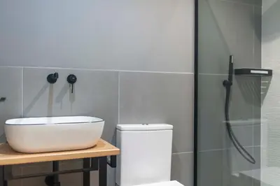 a bathroom with a sink and a shower at Albatros in Puentedeume