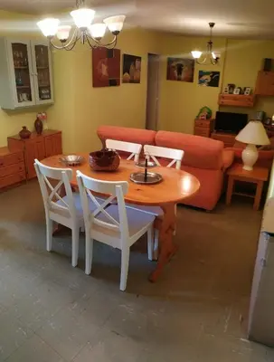 a living room with a table and chairs and a couch at EnFOZ CONFORT Y RELAX in Foz