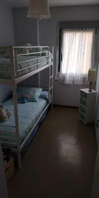 a bedroom with two bunk beds and a window at EnFOZ CONFORT Y RELAX in Foz