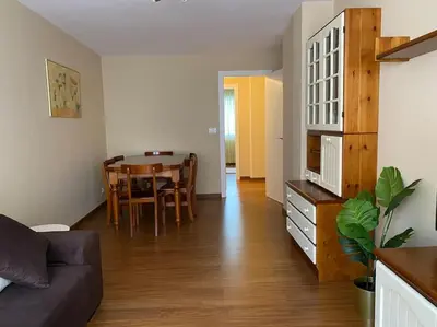 a living room with a couch and a table at Río, mar y montaña in Puentedeume