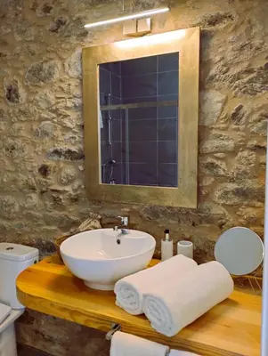 a bathroom with a sink and a mirror at Hotel Pazo de Bieite in Boimorto