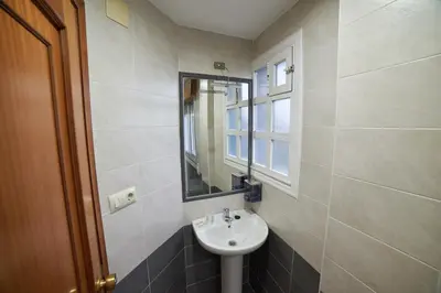 a bathroom with a sink and a mirror at Hostal Molgas in A Medorra
