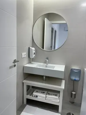 a bathroom with a sink and a mirror at Cepas Da Cuenga in Ribadavia