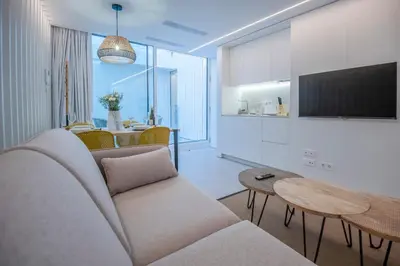 a living room with a couch and a table at Apartamentos Atia Catedral in Santiago de Compostela