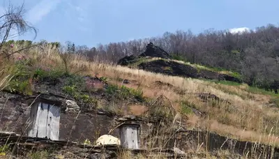 an old building on the side of a hill at O Busto Aldea Rural, Apartamento HORNO 2 in A Pobra do Brollon
