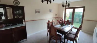 a dining room with a table and chairs and a window at Casa Ángel in Barreiros