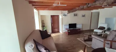 a living room with a couch and a table at Casa Ángel in Barreiros