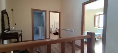 a view of a room with a balcony with a mirror at Casa Ángel in Barreiros