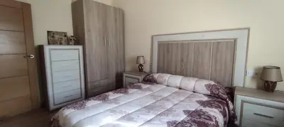 a bedroom with a bed and a dresser at Casa Ángel in Barreiros