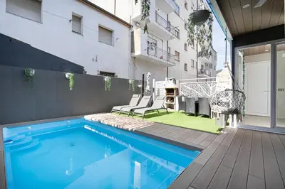 a swimming pool in a backyard with a building at Luxury Barco de Valdeorras in Vegamolinos
