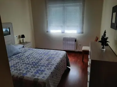 a bedroom with a bed and a window at Lazaro Sol in Viveiro