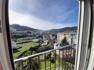 a view of a city from a balcony at Lazaro Sol in Viveiro