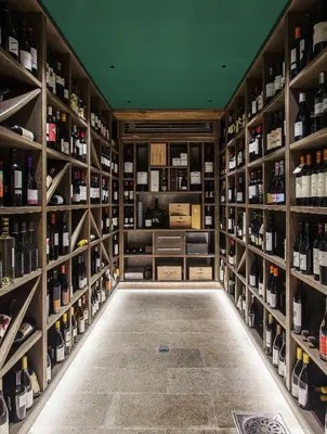 a wine cellar with shelves of wine bottles at Blanco Hotel Spa in Navia