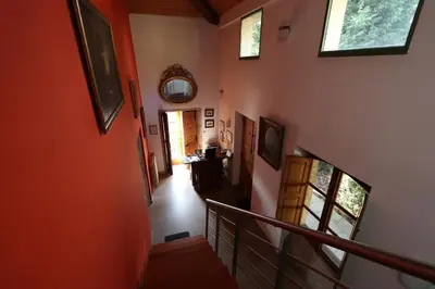 an overhead view of a hallway with orange walls at Casa Grande da Capellania in Padrón