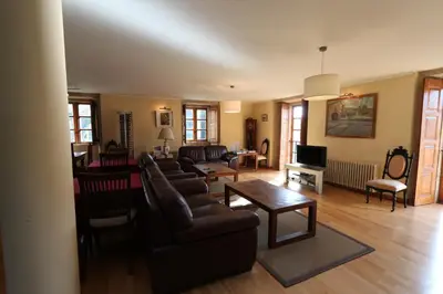a living room with a couch and a table at Casa Grande da Capellania in Padrón