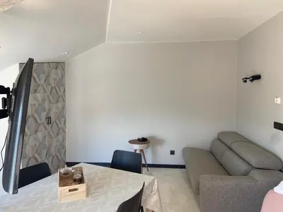 a living room with a couch and a table at Siente Muralla in Lugo
