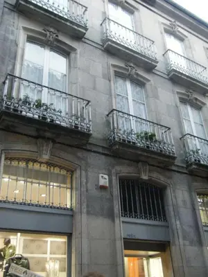 a building with balconies on the side of it at PR Paz de Agra in Santiago de Compostela