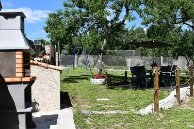 a backyard with a swing set and a playground at Casa Avoa María in Ourense
