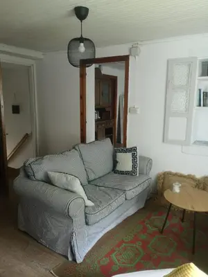 a living room with a couch and a table at Casa O Coto in Grañas