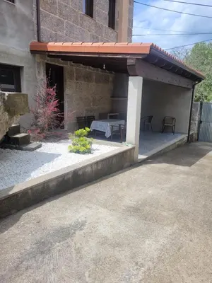 a patio with awning and a table in a building at Casa do Porto in Partovia