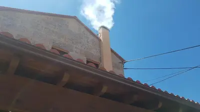 a smoke stack on top of a building at Casa do Porto in Partovia