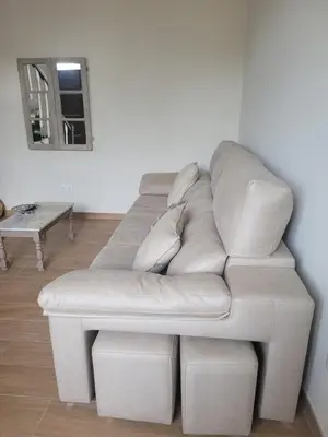 a white couch in a living room with a mirror at Casa do Porto in Partovia