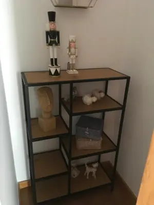 a shelf with some toys on top of it at Alquiler de piso nuevo in Burela de Cabo