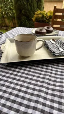 a plate with a coffee cup and donuts on a table at BenedettaMolinaseca VuT in Molinaseca