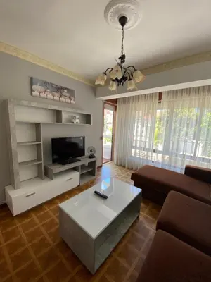 a living room with a couch and a coffee table at Piso grande y muy luminoso in Santiago de Compostela