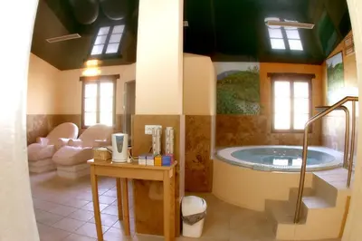 a bathroom with a large tub in a room at Hotel Monumento Pazo do Castro in O Barco de Valdeorras