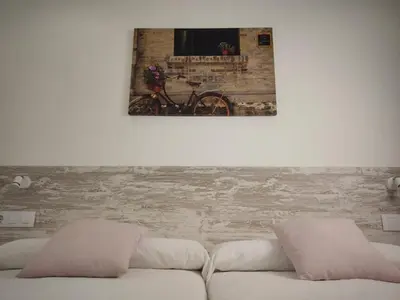 a white couch with two pillows in a living room at Gallaecia in Arzúa