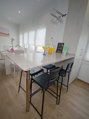 a kitchen with a large marble table and chairs at Gallaecia in Arzúa