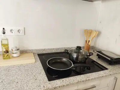 a pot on a stove top in a kitchen at Gallaecia in Arzúa