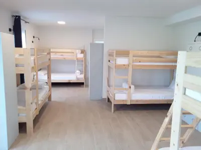 a room with several bunk beds in it at Anam Cara House in Serantes