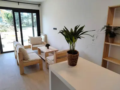 a living room with a potted plant on a counter at Anam Cara House in Serantes