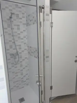 a shower with a glass door in a bathroom at Anam Cara House in Serantes